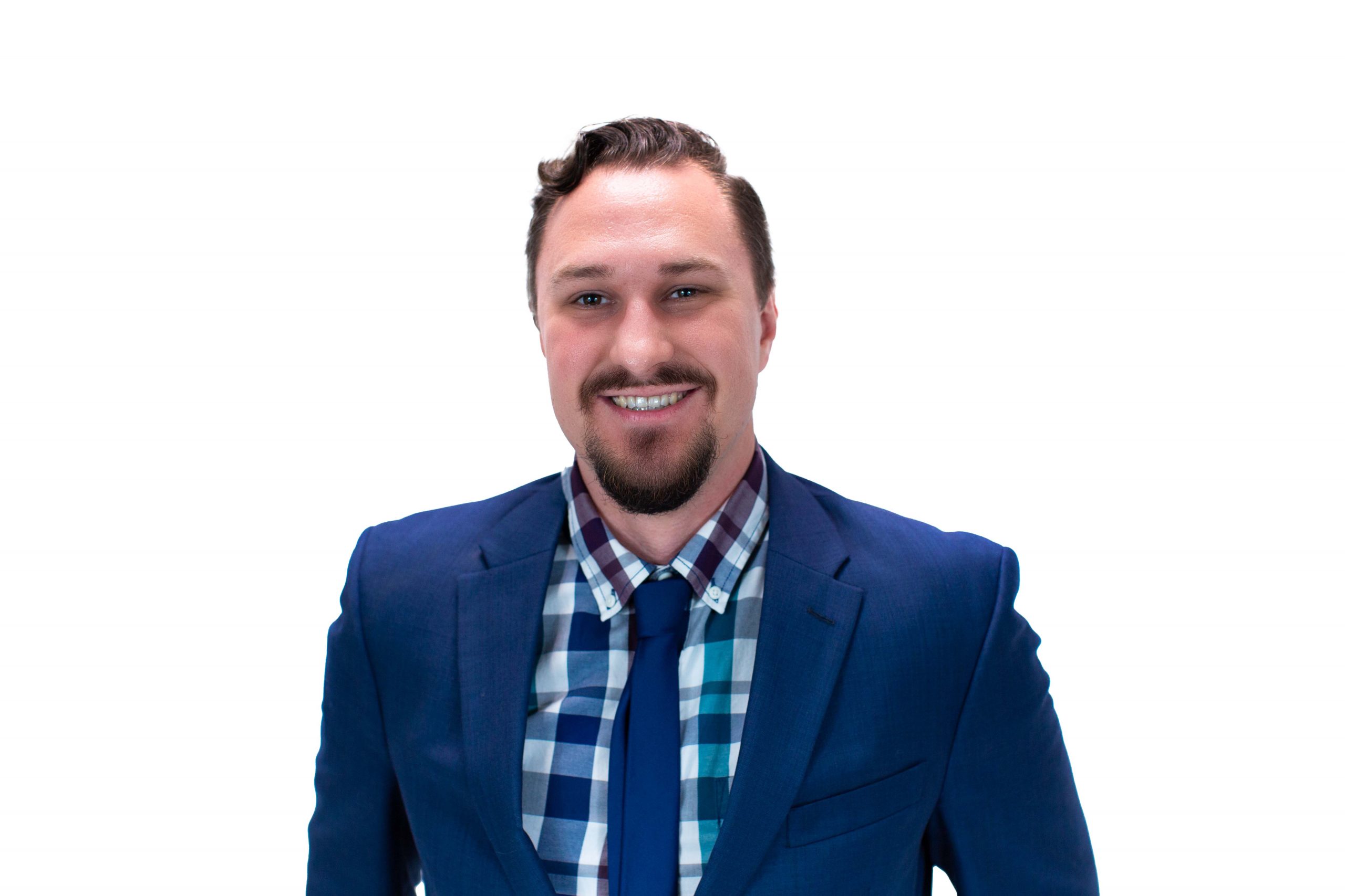 Dylan Allen smiling in a blue suit with a blue tie