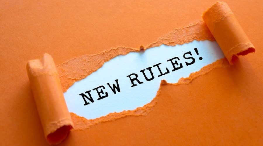 new rules under torn paper_shutterstock_2205040921 900x500