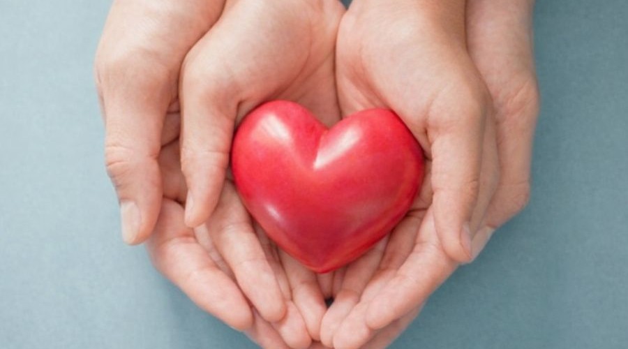 hands holding a red heart_shutterstock_2694926897_image credit chatgpt 900x500