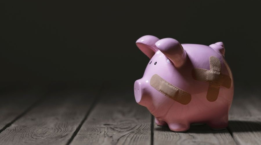 broken piggy bank with band aid bandage_shutterstock_1931494634 900x500